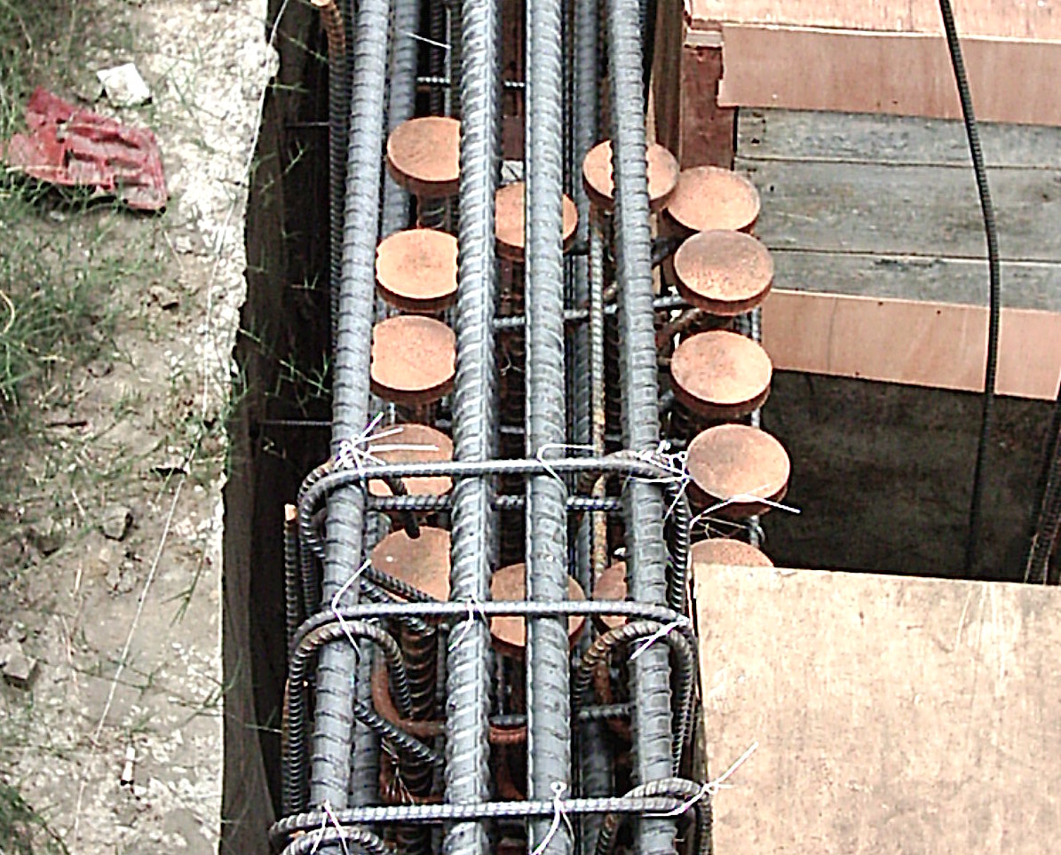 T-head mechanical anchorage applied to a basement exterior wall